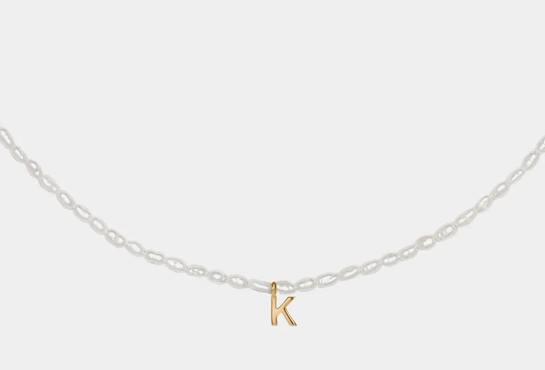 Pearl necklace with a gilded letter K  1